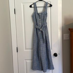 Ankle length tweed jumpsuit with pearl belt detail at the waist